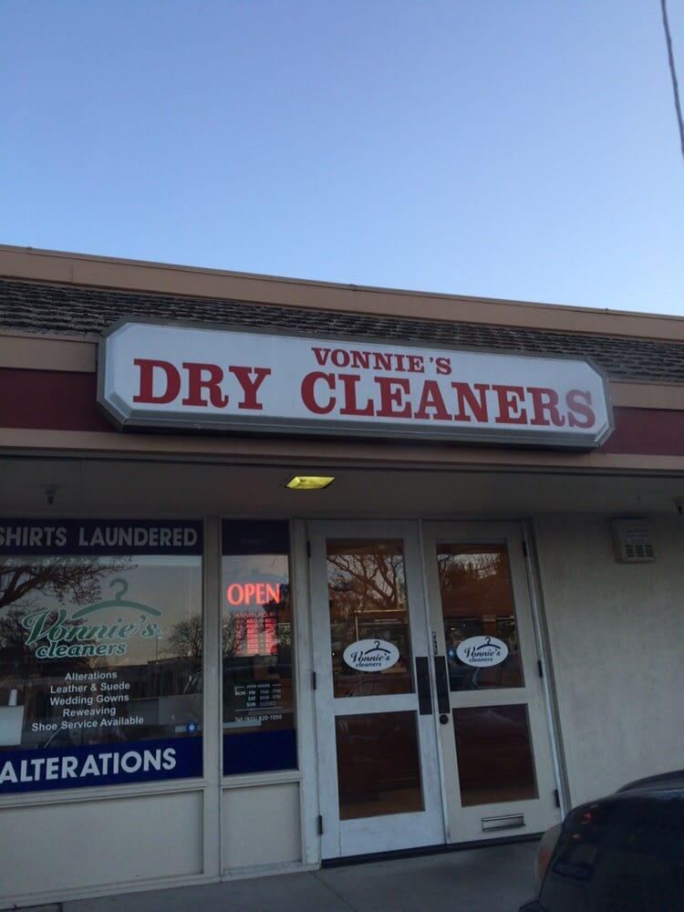 Vonnie's Dry Cleaners sign above glass doors, with an Alterations banner and the Vonnie's cleaners logo in the window.