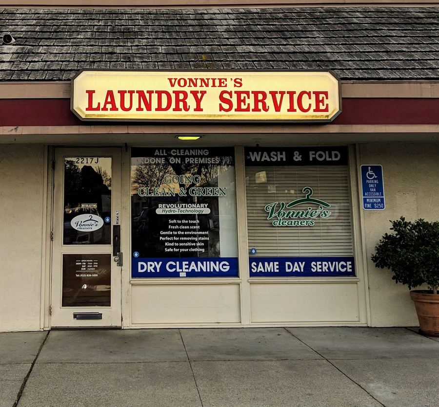 The Vonnie's Laundry Service storefront, with Dry Cleaning, Wash & Fold and Same Day Service signs in the windows.